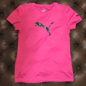 Pink Puma shirt.